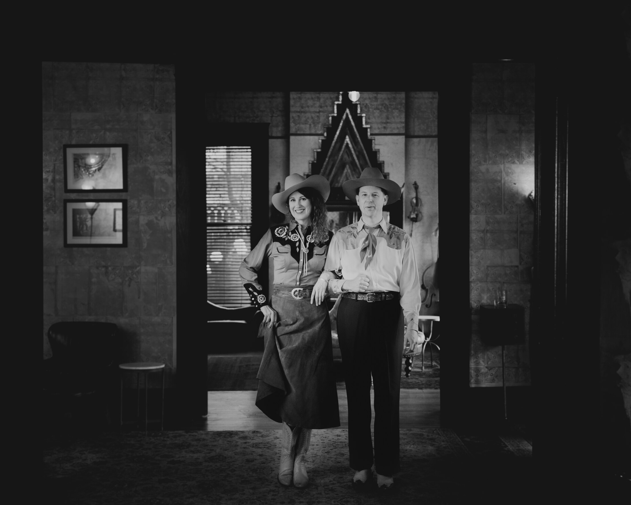 The Farmer and Adele framed in a dark doorway