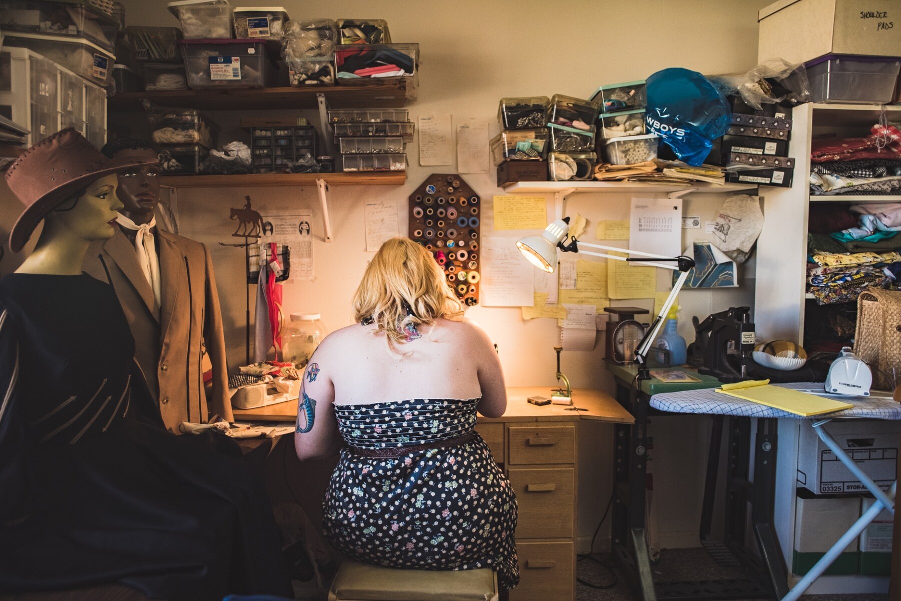 Riley working at a table in her studio