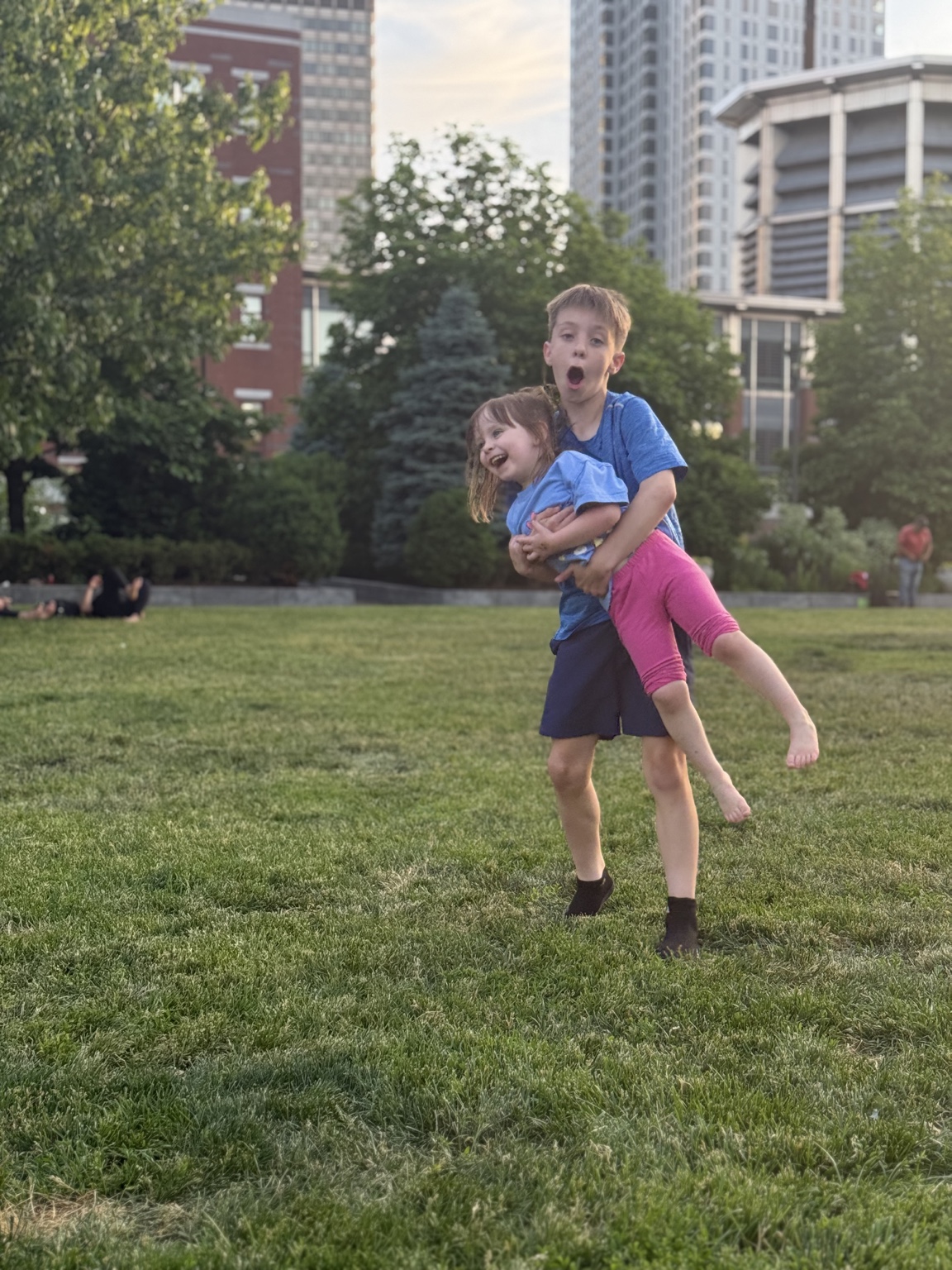 Charlie and Zoe playing together on the lawn