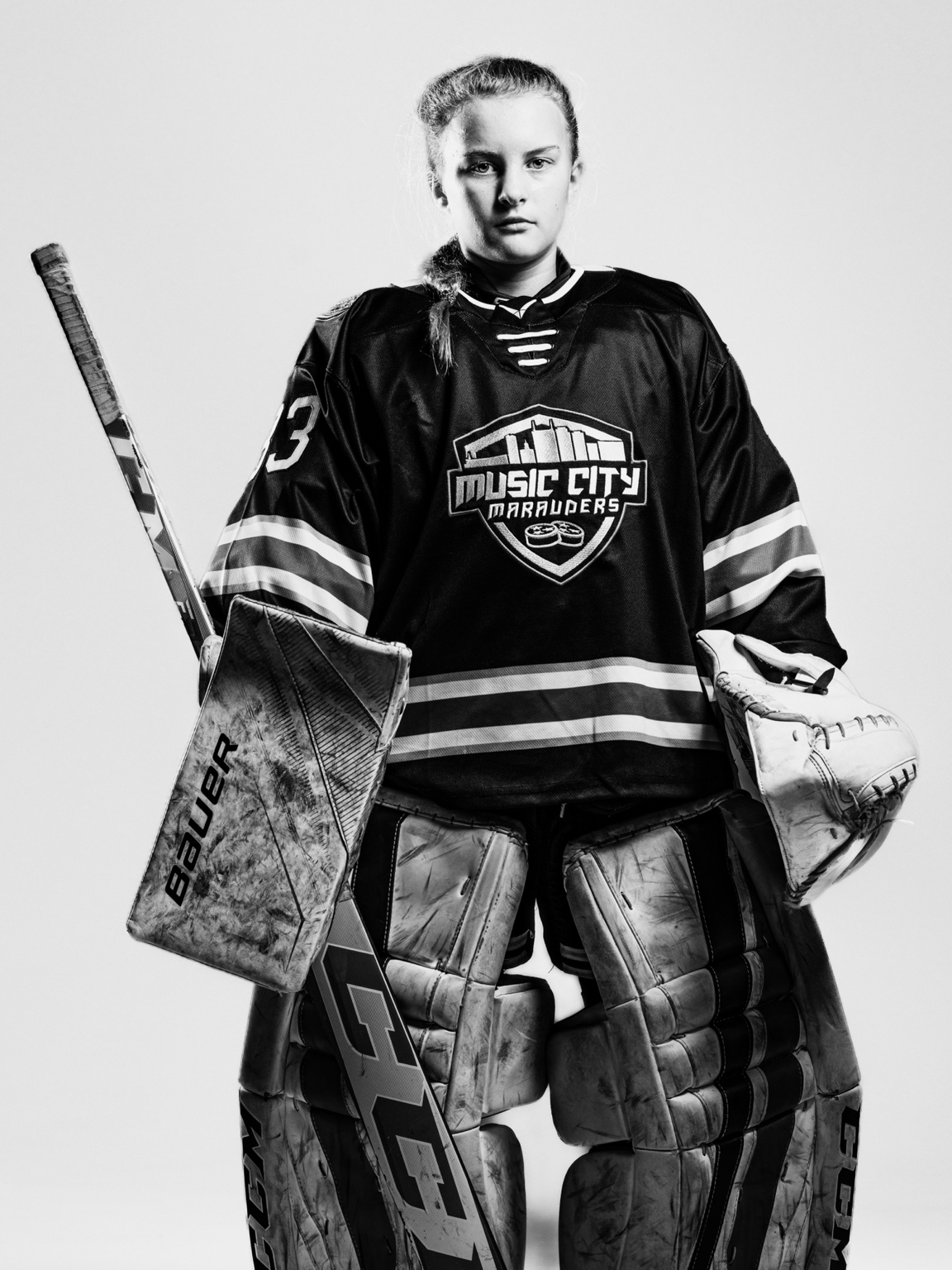 Black-and-white portrait of Nora in her hockey goalie gear