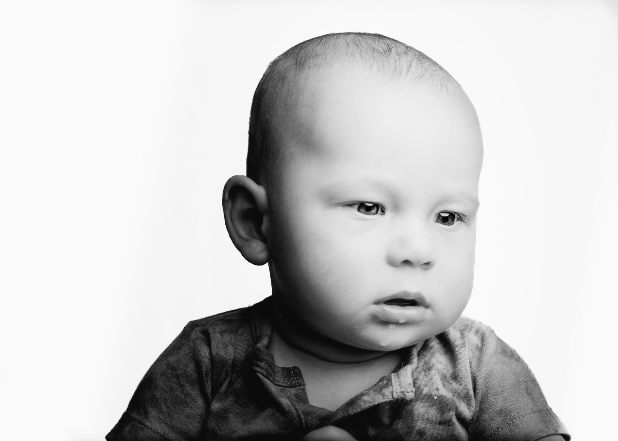 Quiet black and white portrait of a baby