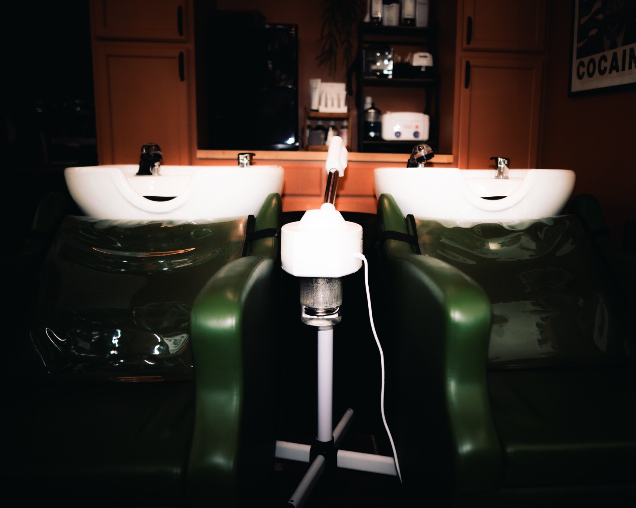 Green shampoo chairs inside The Walden Salon